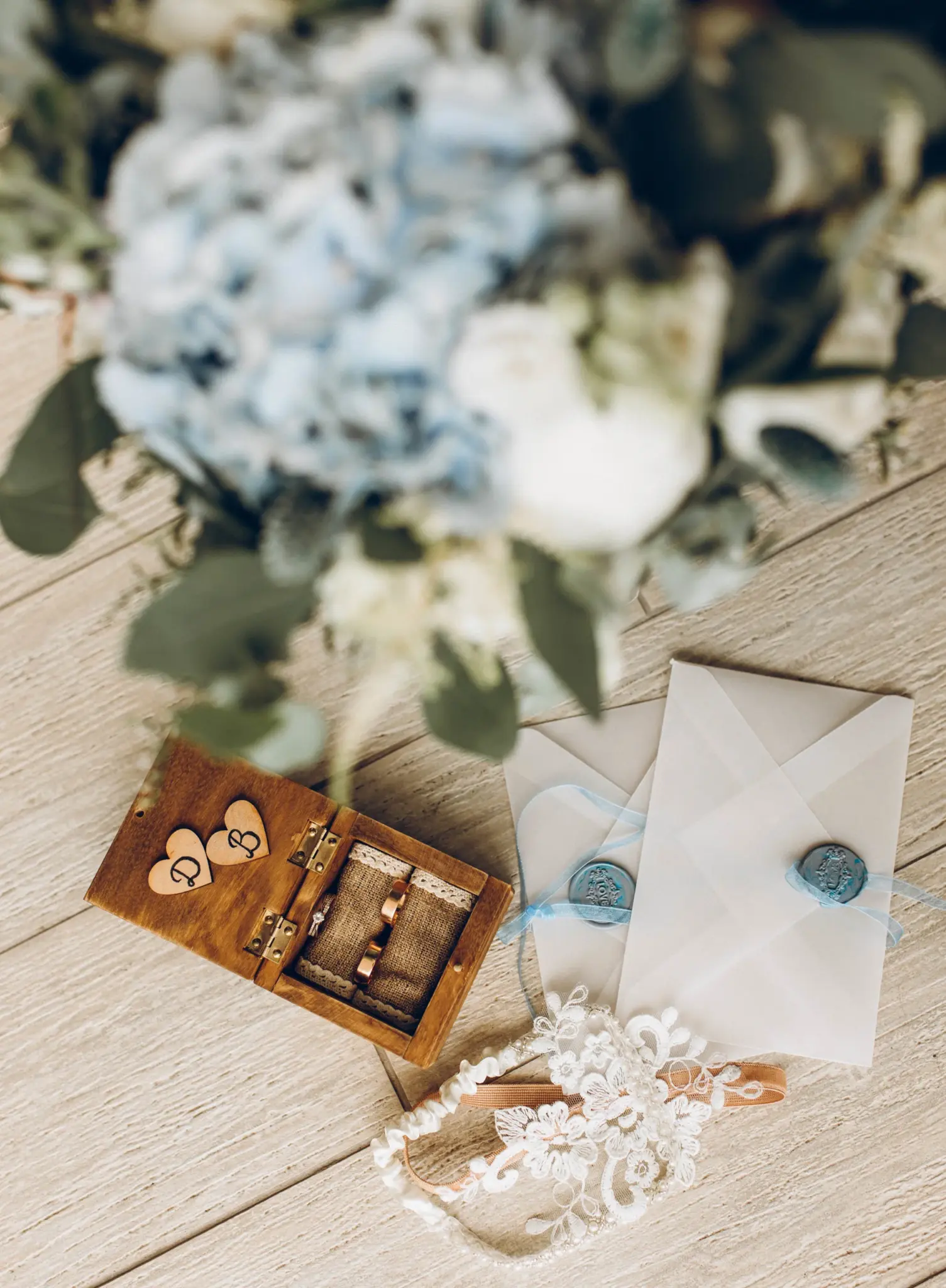 Wedding rings and details with blue hydrangeas