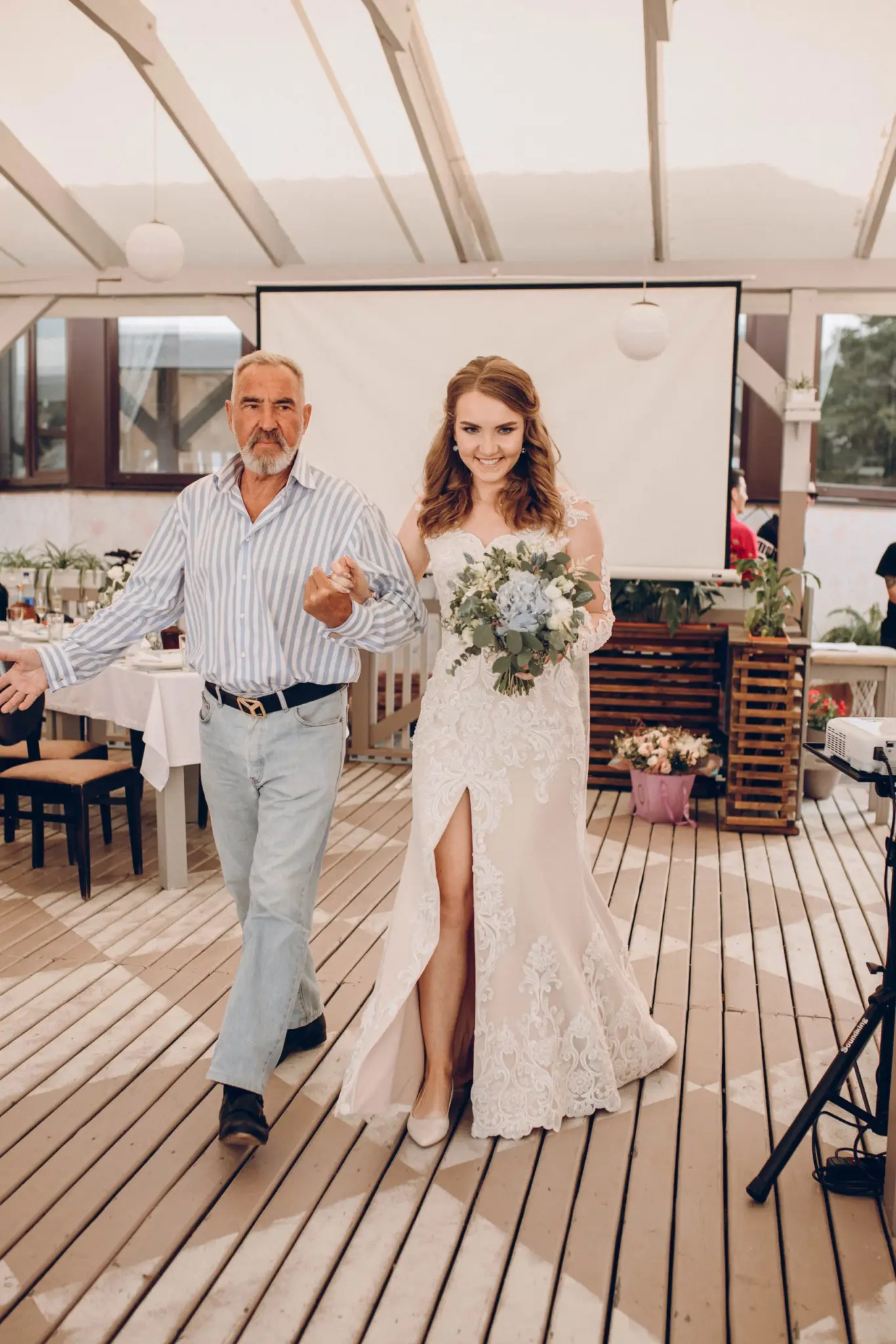The bride walking in with her father