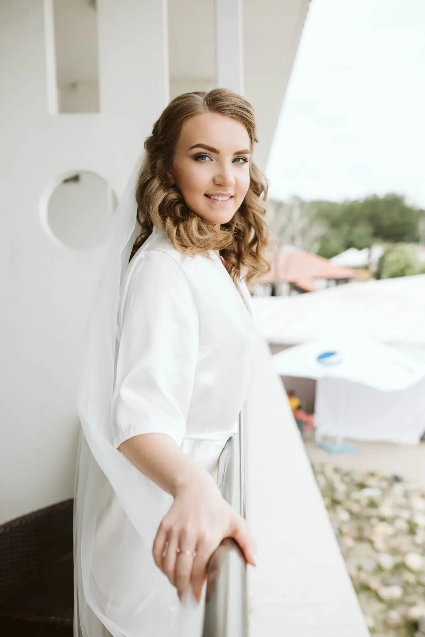 The bride by the window on her wedding morning