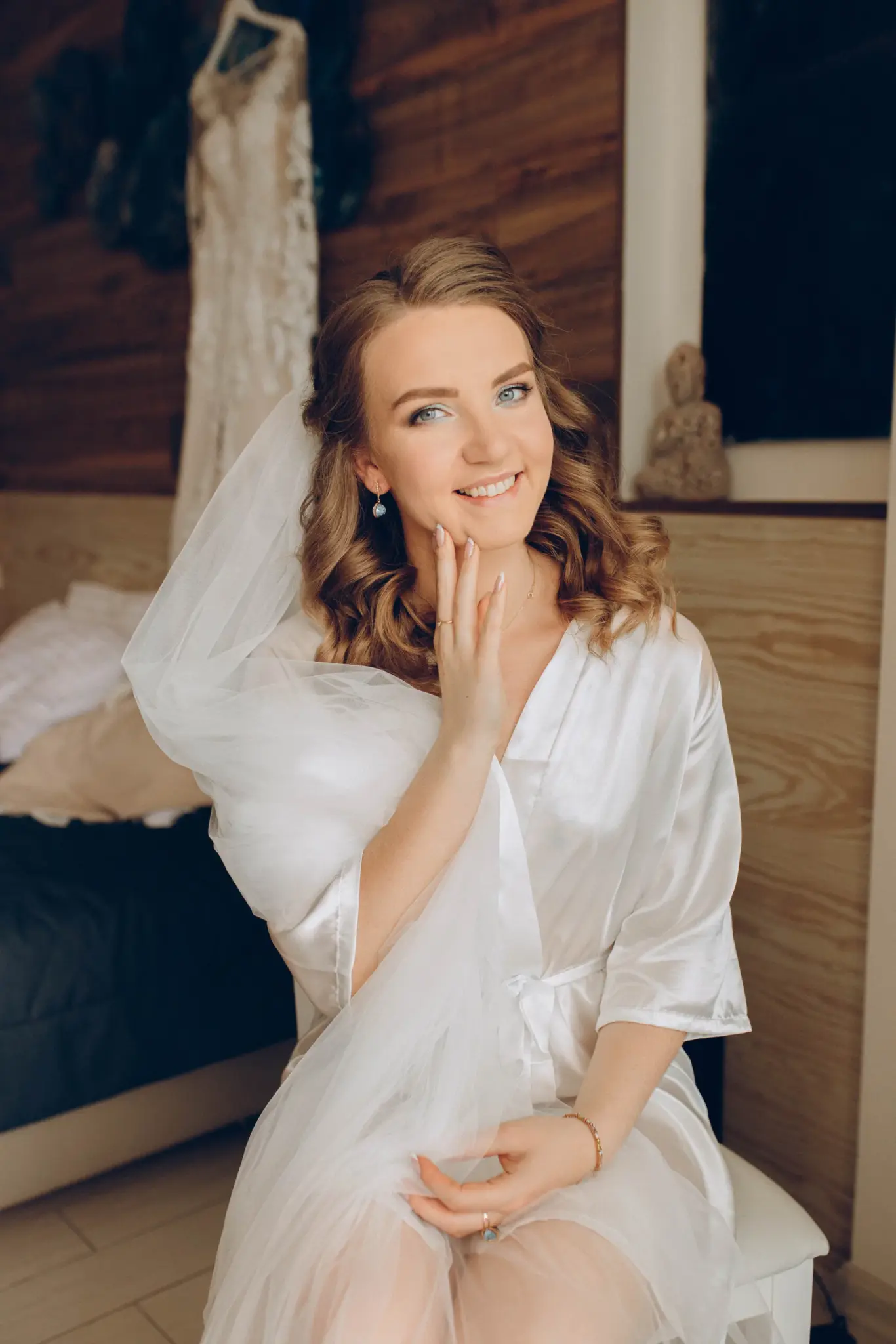 The bride smiling on her wedding morning