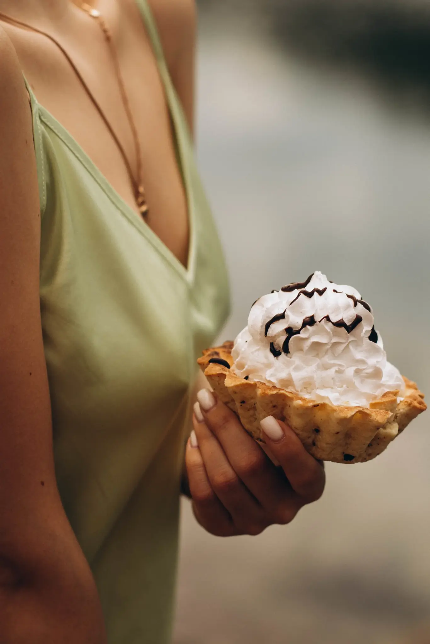 A whipped cream cake in Christina’s hands