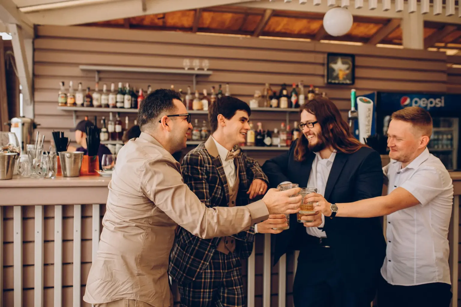 The groom and his friends at the bar