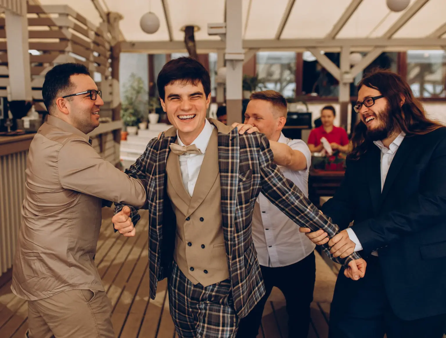 The groom laughing with his friends