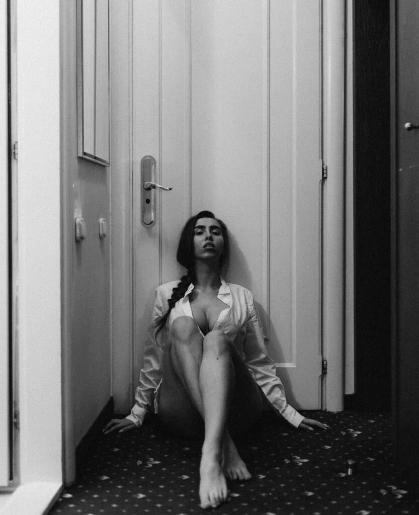Paris boudoir photoshoot, artistic black and white portrait in a white shirt by Julia Litvin
