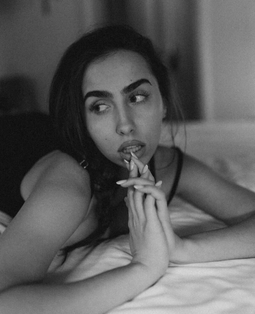 Classy boudoir photoshoot in Paris, expressive black and white portrait on soft linen by Julia Litvin