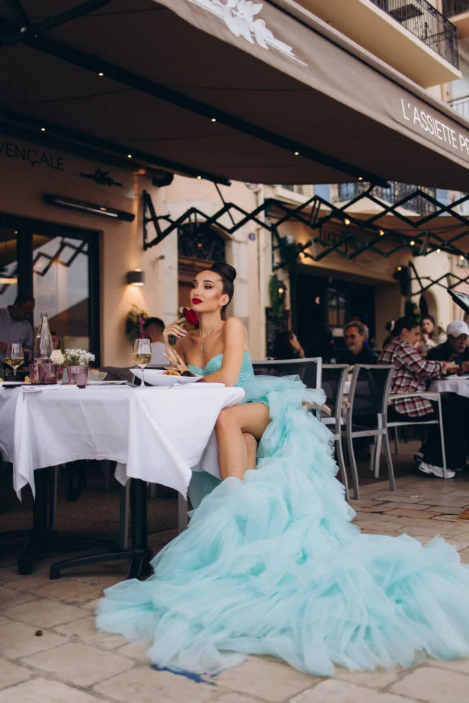 Cannes photography at a restaurant in a flying dress