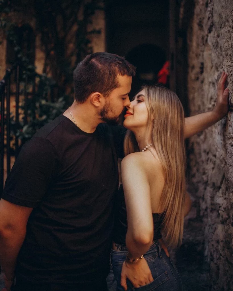 Couple sharing an intimate moment during a romantic photoshoot in Nice, France