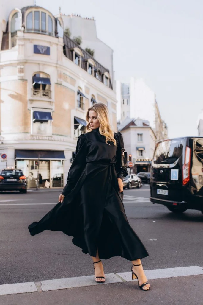 Paris fashion photographer street shoot in a black satin dress
