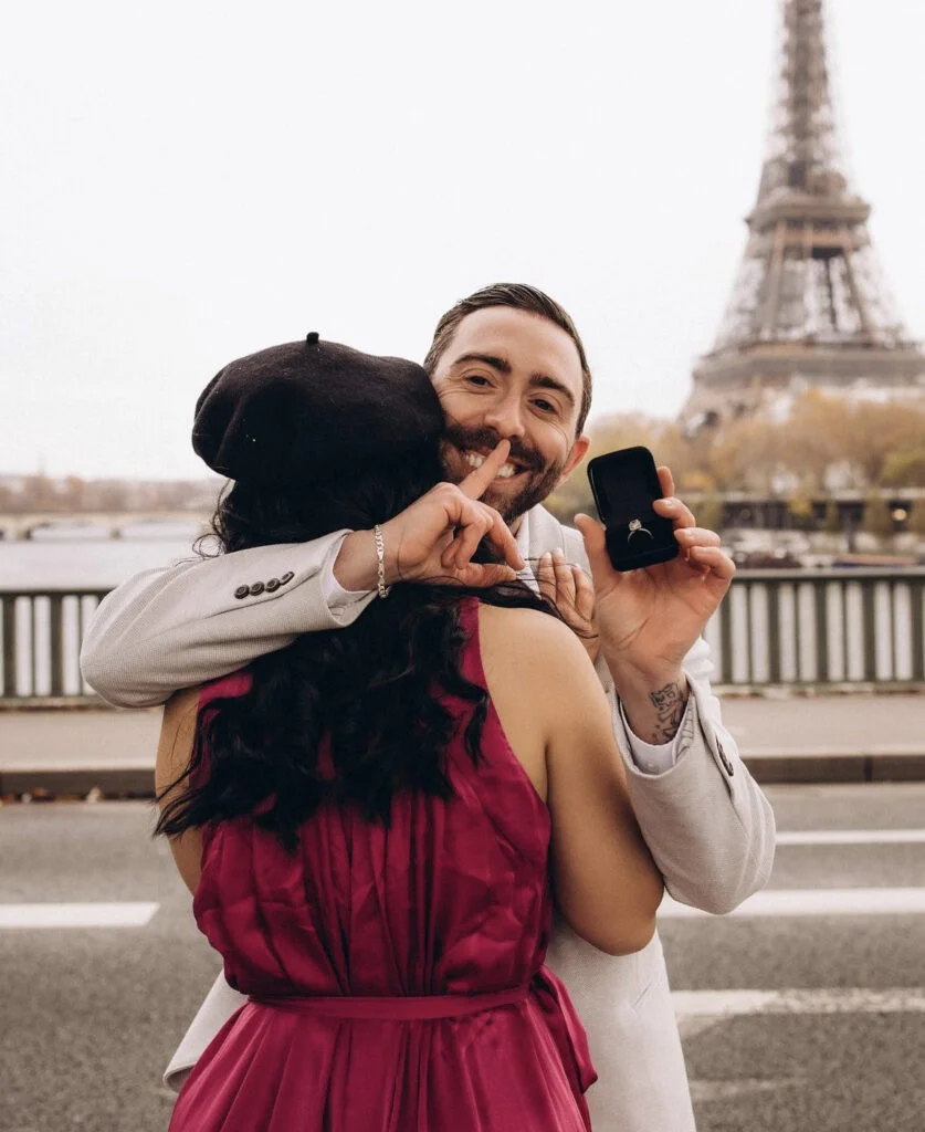 Secret ring reveal during a Paris marriage proposal by the Eiffel Tower