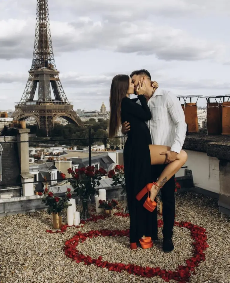 Rooftop proposal in a heart of roses with the Eiffel Tower on the skyline
