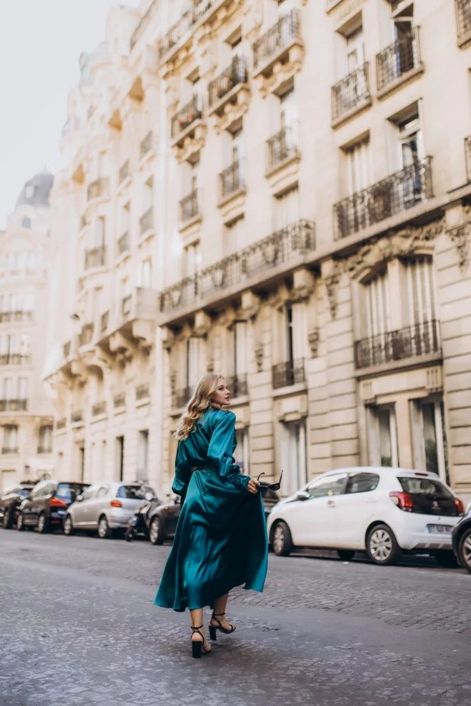 Fashion photoshoot in Paris in an emerald satin dress by Julia Litvin