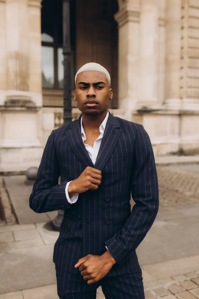 Male fashion photoshoot in Paris in a pinstripe suit by Julia Litvin