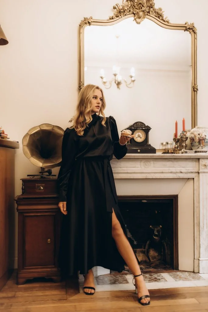 Indoor fashion photography in Paris in a black satin dress by Julia Litvin