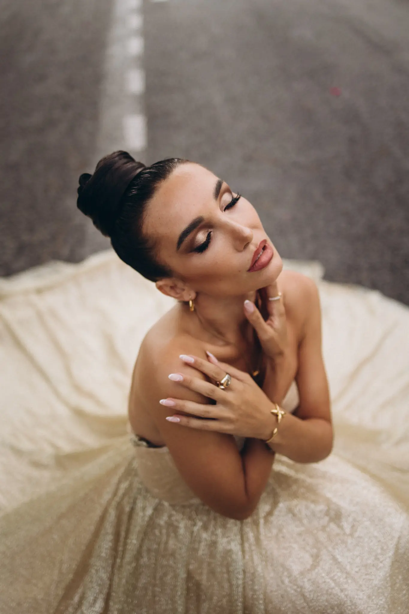 Close portrait of a woman in a champagne gown in Cannes
