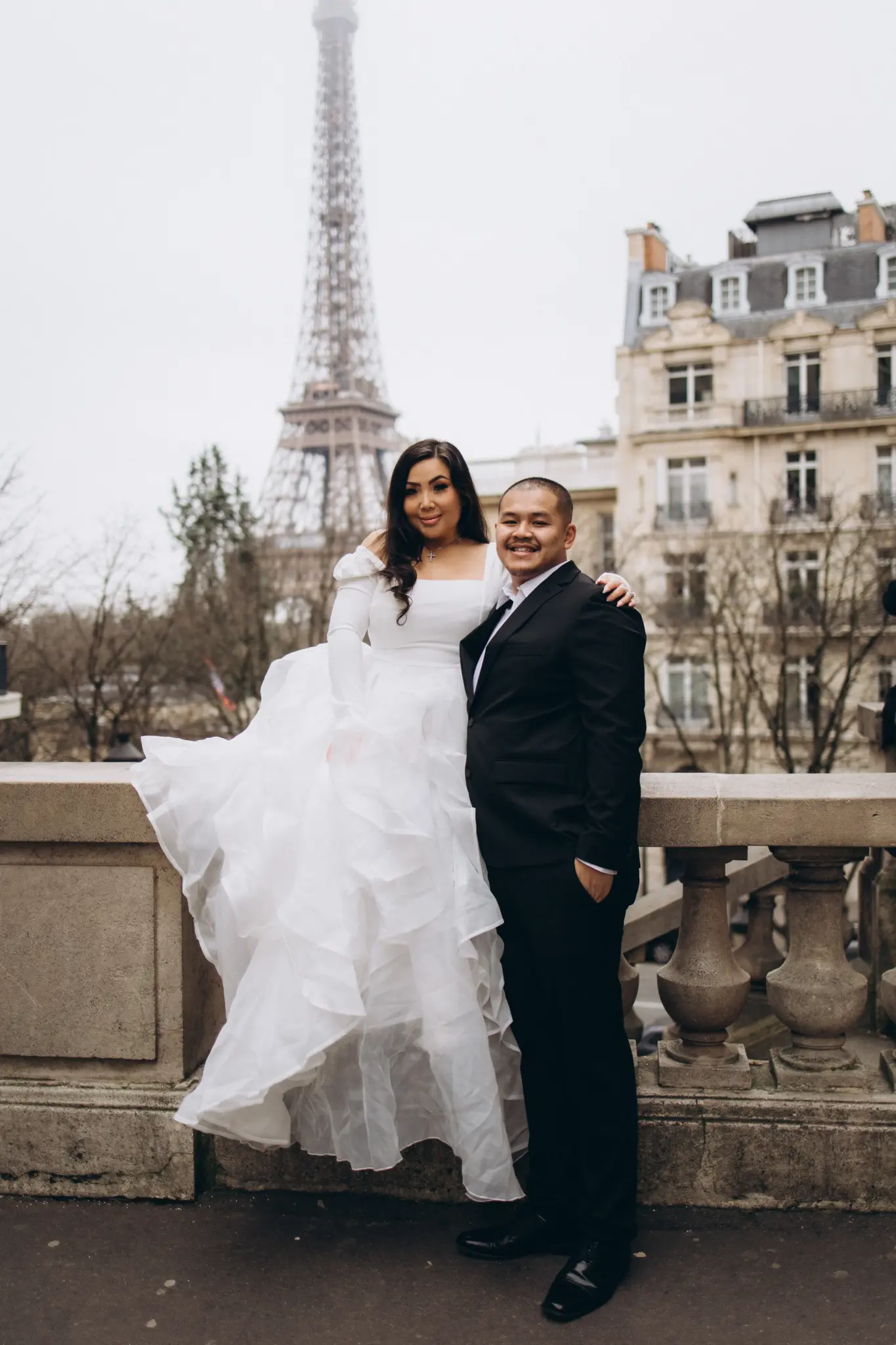 Bride’s full white gown in motion at Avenue de Camoëns, Eiffel Tower in the background