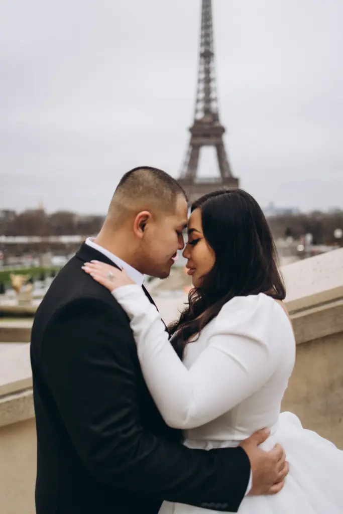Bride and groom embracing on the Trocadéro esplanade with the Eiffel Tower