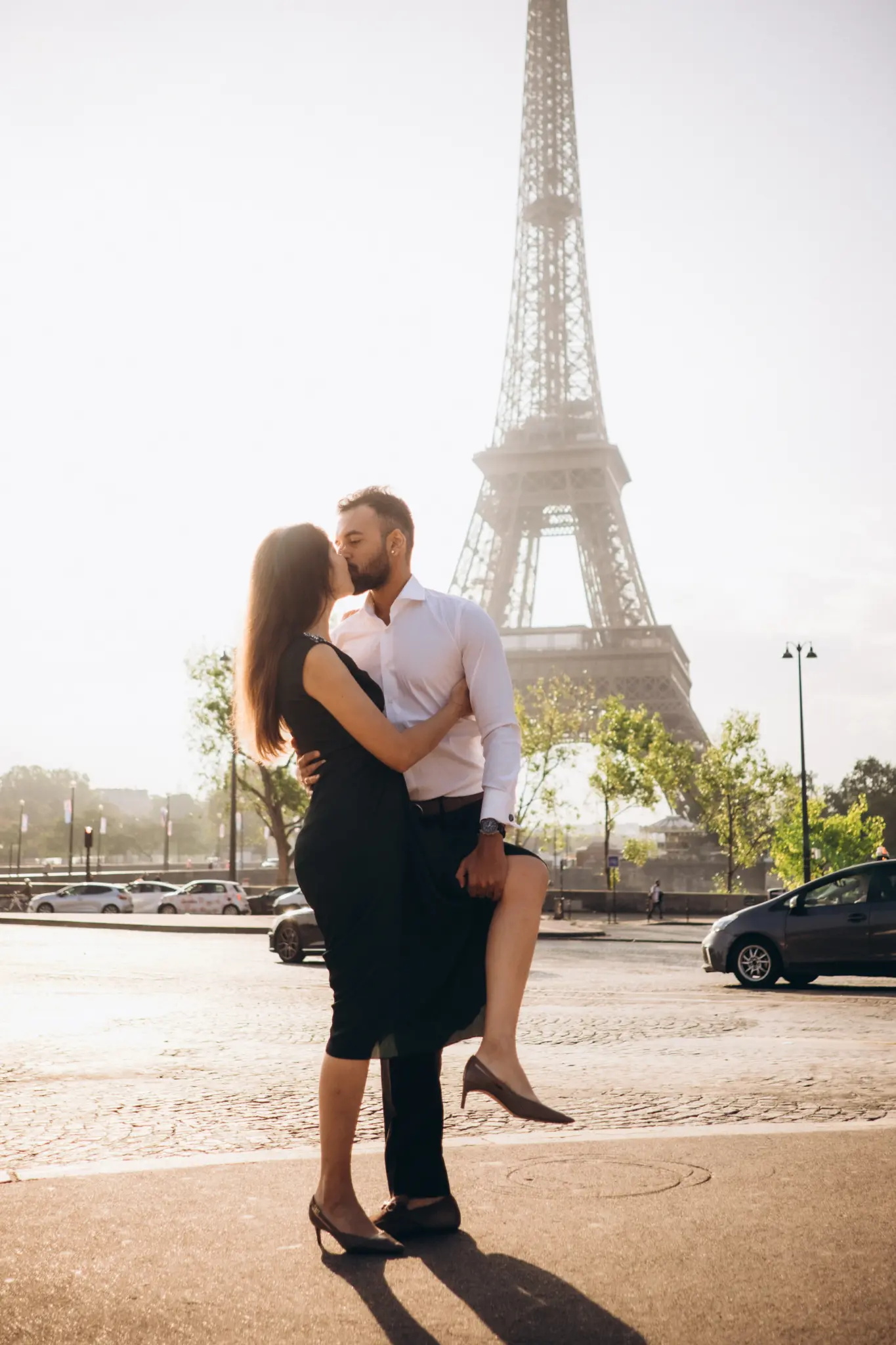 Couple embracing in front of the Eiffel Tower