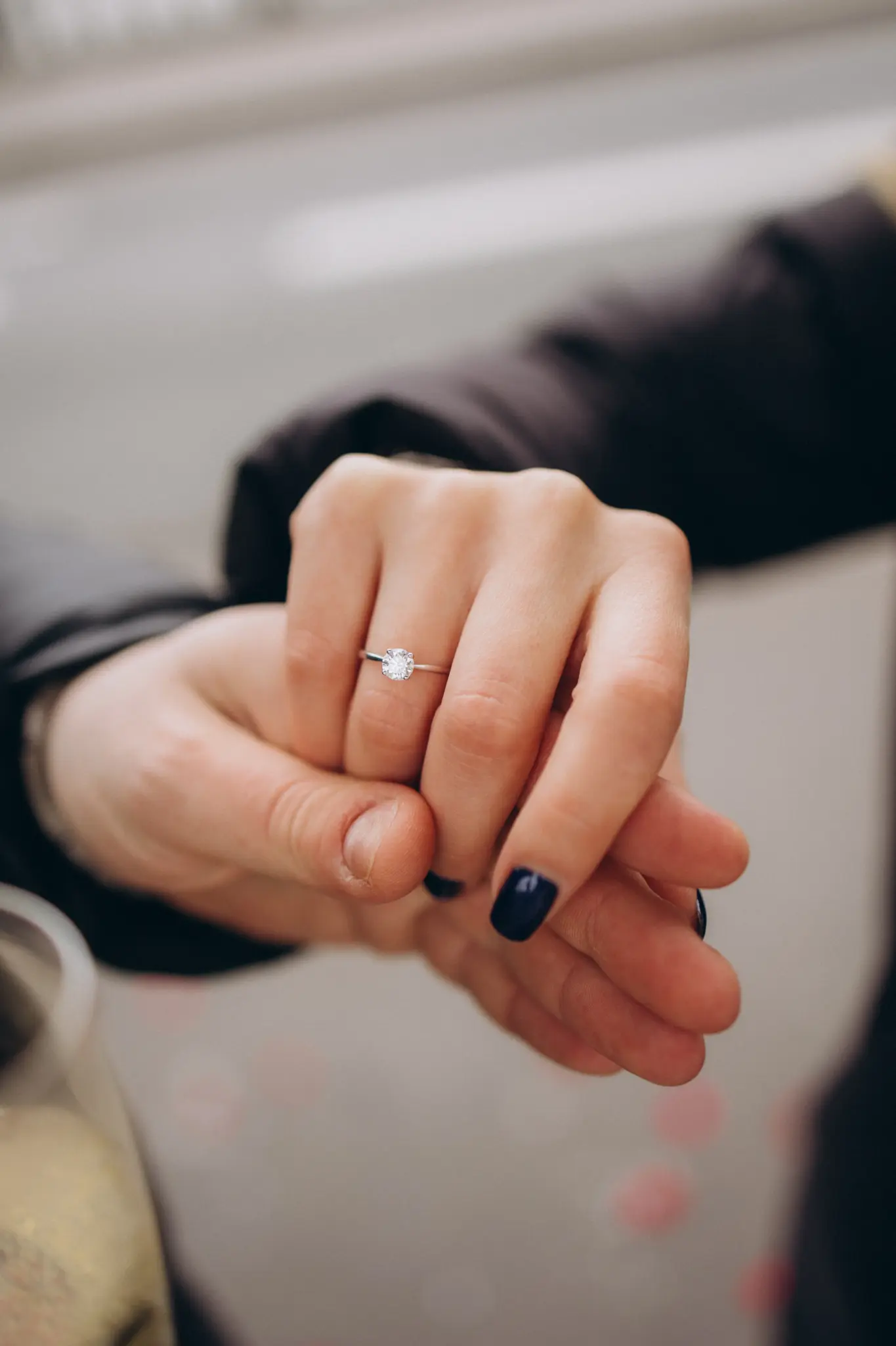 Close-up of an engagement ring on her hand after a proposal in Paris