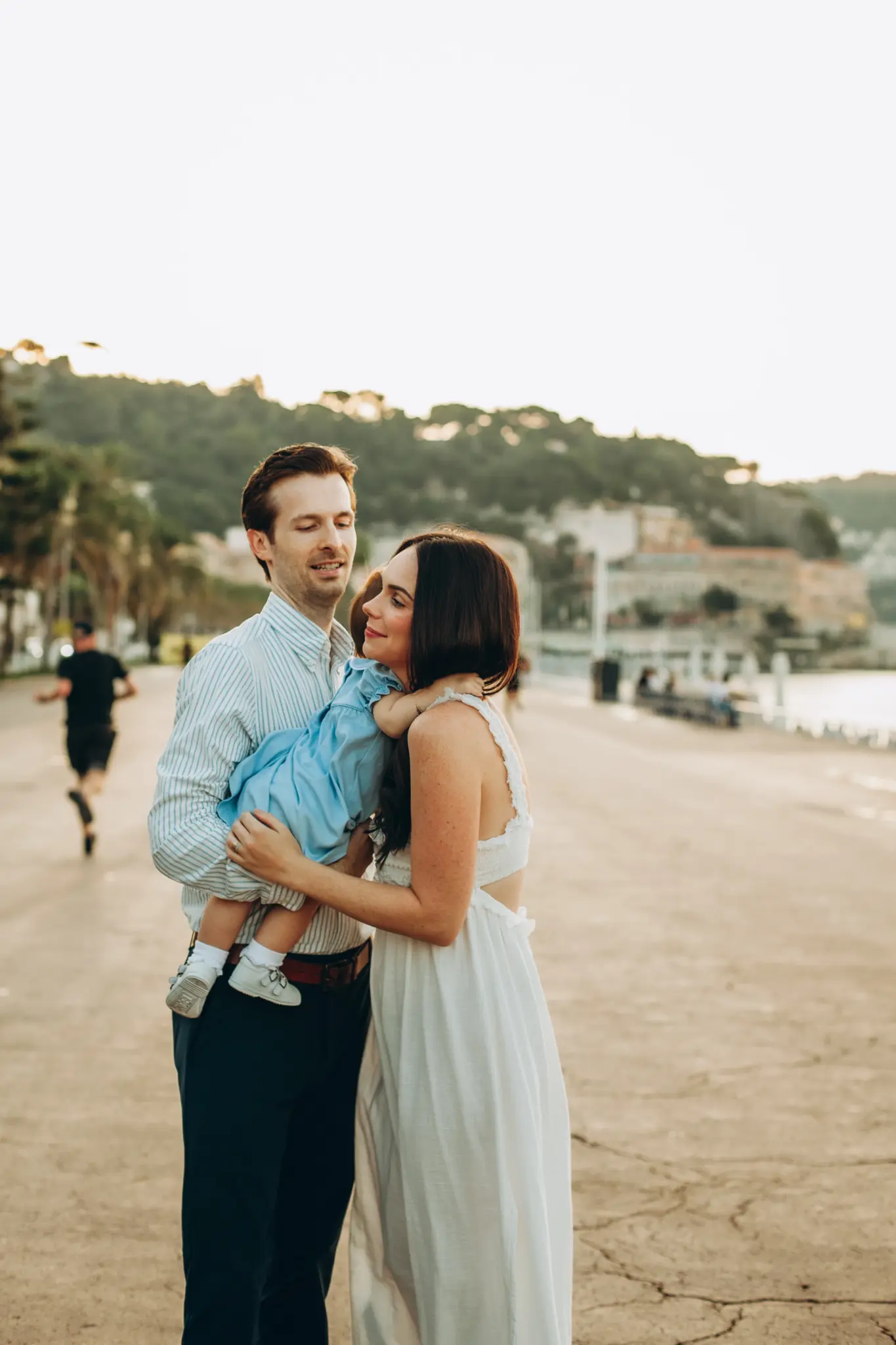 Family with a baby on the seafront promenade in Nice
